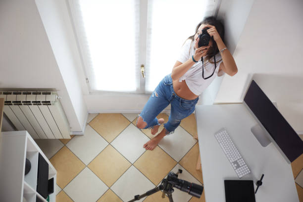 istock Young female photographer working on her desk 1485739430