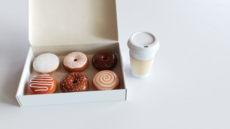 Donuts in a Box and Coffee. 4K video.