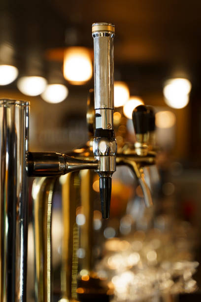 istock Beer pub bar. Beer taps with beer in a restaurant. 1485746942
