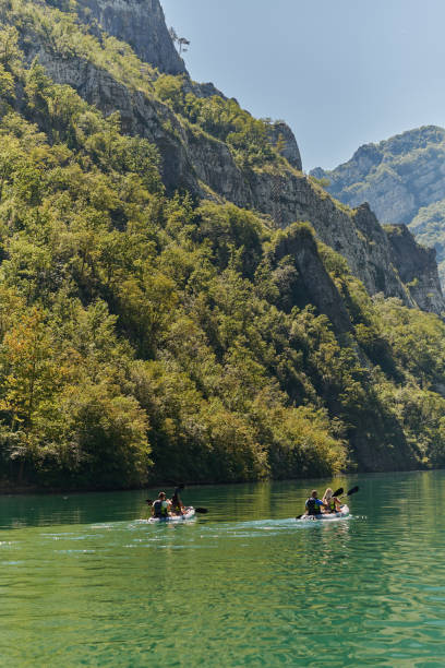 istock A group of friends enjoying having fun and kayaking while exploring the calm river, surrounding forest and large natural river canyons 1485746950