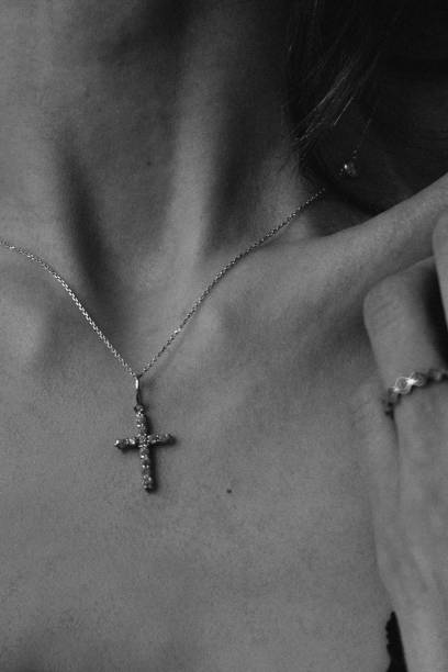 istock Girl's collarbone, chain with a cross 1485747951