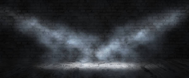 istock Background of an empty dark-black room. Empty brick walls, lights, smoke, glow, rays 1485750702