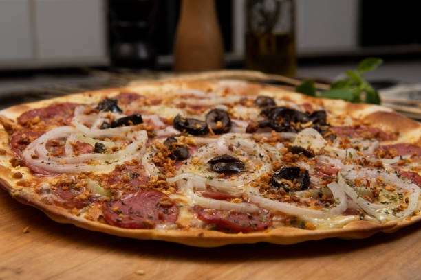 istock Brazilian pizza with pepperoni, cheese, onion and black olive 1485754793
