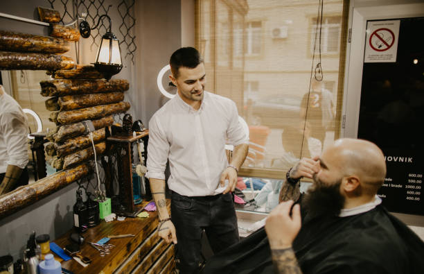 istock Young man explaining to his barber what beard style he wants 1485755358