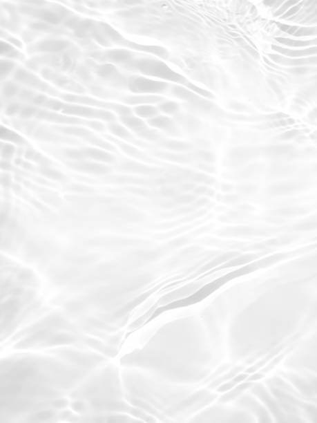 istock White water with ripples on the surface. Defocus blurred transparent white colored clear calm water surface texture with splashes and bubbles. Water waves with shining pattern texture background. 1485760201