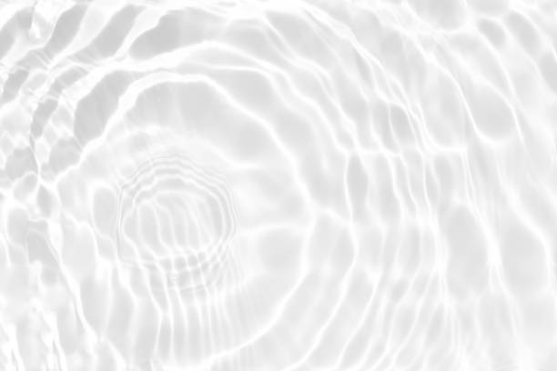 istock White water with ripples on the surface. Defocus blurred transparent white colored clear calm water surface texture with splashes and bubbles. Water waves with shining pattern texture background. 1485761538