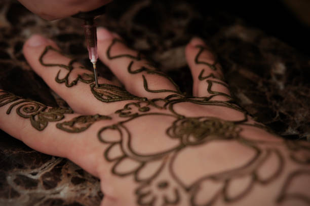 istock A temporary tattoo is drawn on the hand with henna. 1485762102