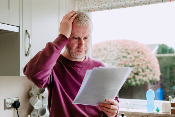 istock Worried man checking energy bills at home 1485769782