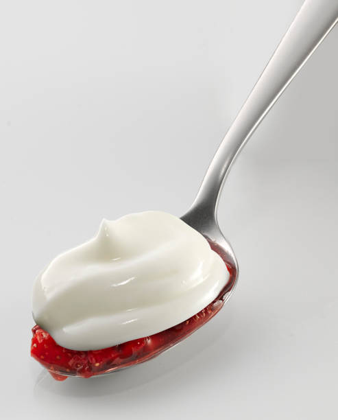 istock Yogurt on spoon,  strawberry, isolated on white background 1485770802
