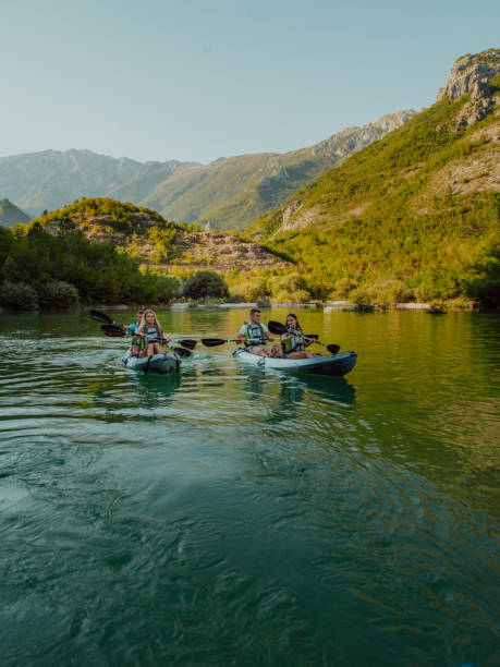 istock A group of friends enjoying having fun and kayaking while exploring the calm river, surrounding forest and large natural river canyons 1485773938