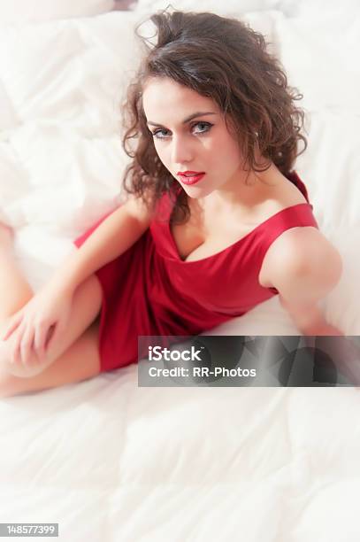 Young Woman With Dark Brown Hair In Bed Stock Photo - Download Image Now - Adult, Adults Only, Bed - Furniture