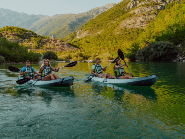 istock A group of friends enjoying having fun and kayaking while exploring the calm river, surrounding forest and large natural river canyons 1485774089