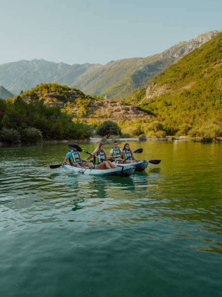 istock A group of friends enjoying having fun and kayaking while exploring the calm river, surrounding forest and large natural river canyons 1485774533