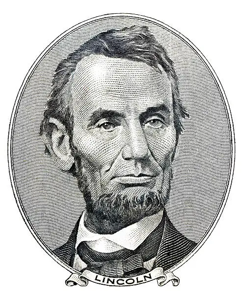 Portrait of former U.S. president Abraham Lincoln as he looks on five dollar bill obverse
