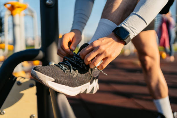 istock Young Man Tying Up Shoelaces Before Jogging 1485776532