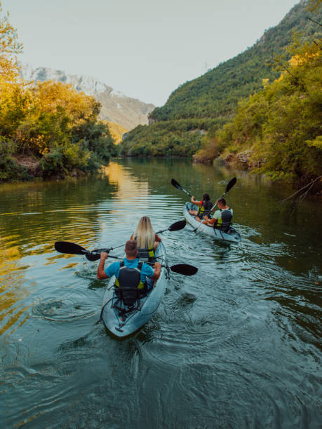 istock A group of friends enjoying having fun and kayaking while exploring the calm river, surrounding forest and large natural river canyons 1485776644