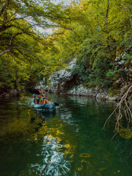 istock A group of friends enjoying having fun and kayaking while exploring the calm river, surrounding forest and large natural river canyons 1485776984