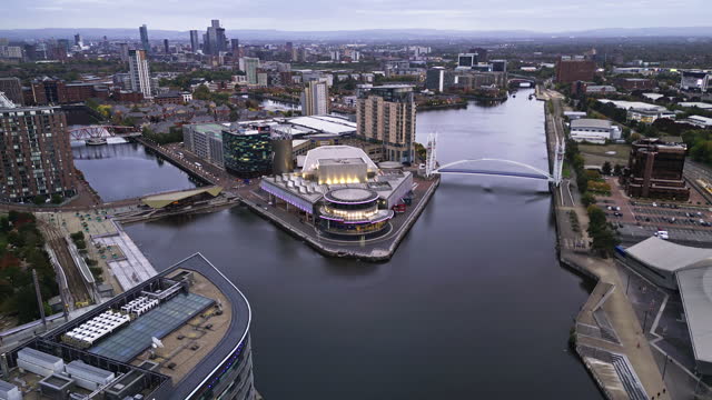 4K Aerial view Real time Footage of above The Media, Salford Quays in Manchester City, England, United Kingdom