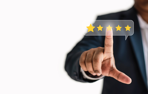 the idea of rating placement. Businessman examining technology on a blue background with a five-star rating, concept of service performance, quality, and satisfaction.area for copy in a web banner.