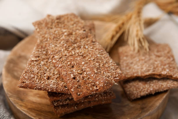 istock Stack of dry rye crispbreads on table, closeup 1485780259