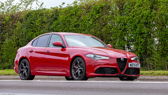 Bicester,Oxon,UK - April 23rd 2023. 2022 red ALFA ROMEO   GIULIA VELOCE TB AUTO travelling on an English country road