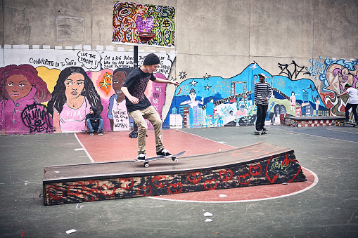 New York City - May 22 2011 :  Skateboarder performing a skateboard trick on sport ramp in the former Skate park at Open Road Park in the East Village