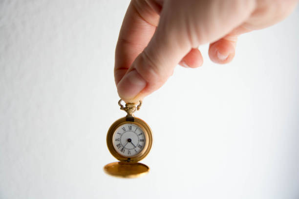 istock Hand with a golden  pocket watch. Concept time. Space copy 1485790243