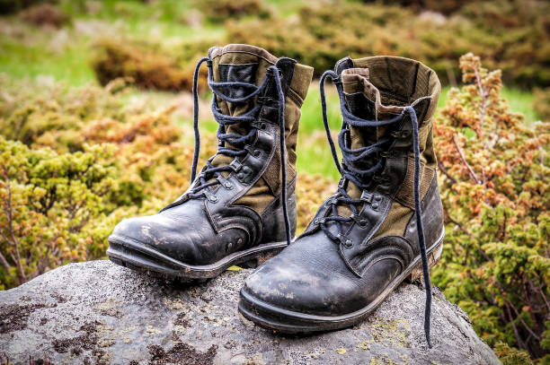 istock Military hiking boots on the stone 1485793011