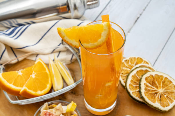 Orange juice with dry lemon and orange slices.