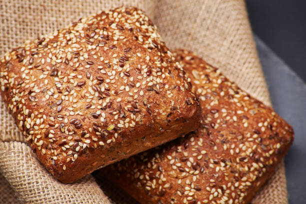 istock Freshly baked rustic bread loaves with sesame seeds 1485796677