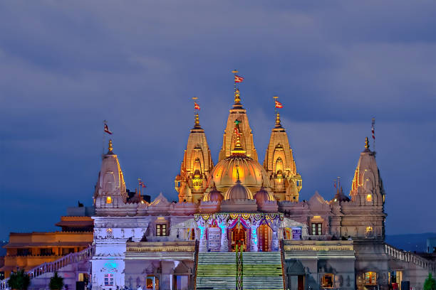 istock Night illuminated Shree Swaminarayan temple with dark blue clouds background, Pune . 1485796887
