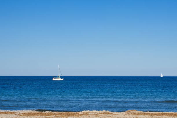 istock Nice seascape with boats going through the surf in vacation time 1485797670