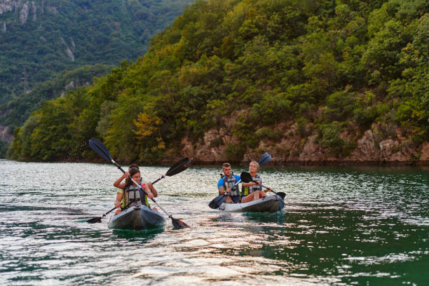 istock A group of friends enjoying having fun and kayaking while exploring the calm river, surrounding forest and large natural river canyons 1485799329