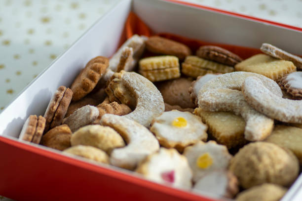 istock Various traditional Christmas sandbakelse, gingerbread and vanillekipferl arranged in white and red box on stars tablecloth 1485799623