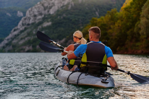 istock A group of friends enjoying having fun and kayaking while exploring the calm river, surrounding forest and large natural river canyons 1485801318