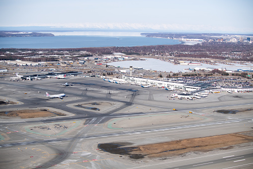 Aerial view of a beautiful Alaska landscape and of Ted Stevens Anchorage International Airport, Alaska April 2022