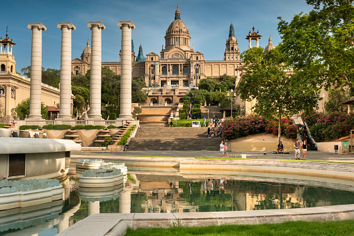 Barcelona, Spain - June 17, 2022: Palau Nacional or Montjuïc National Palace Art Museum of Catalonia and the Magic Fountain in Barcelona Spain which was the main site of the 1929 International Exhibition