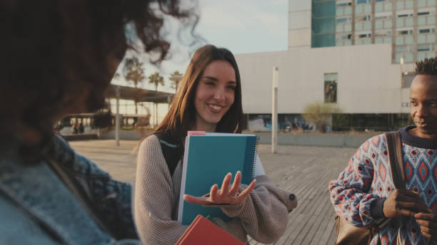 istock Group of students met from outside. Young people discuss school projects 1485809089