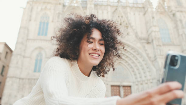 istock Young woman is sitting down on a cell phone 1485810164