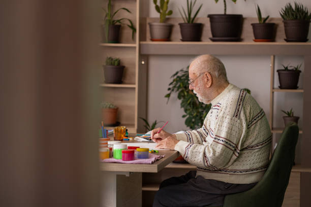 istock Lonely man painting at her home 1485812552