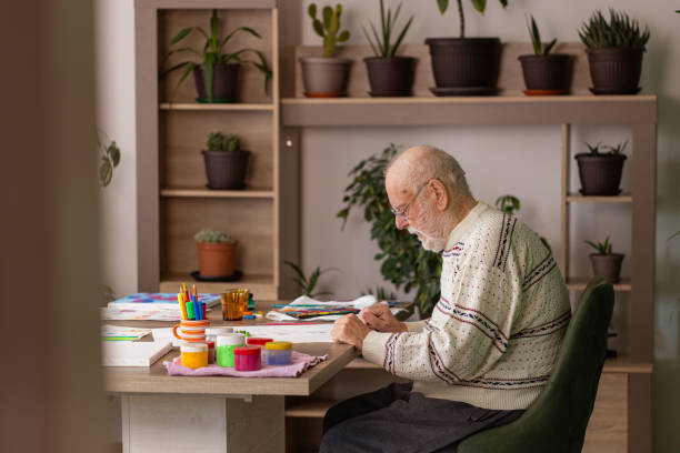 istock Male artist paints on a canvas in his studio 1485812702