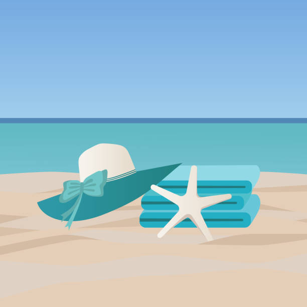 Seaside vacation concept. A stack of towels and a beach hat lie on a sandy beach Seaside vacation concept. A stack of towels and a beach hat lie on a sandy beach, the composition is decorated with a starfish plage stock illustrations