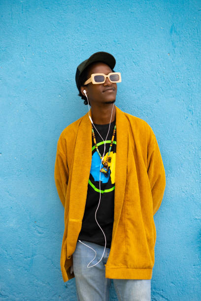 istock Casual young man with hands behind his back and  looking away 1485815201
