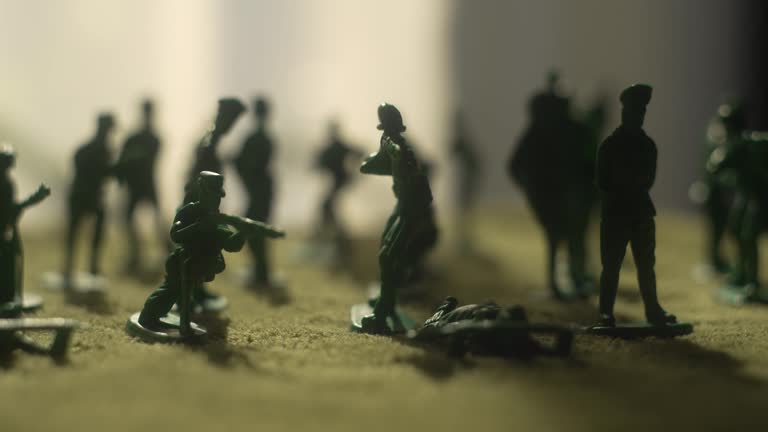 War soldier toy. Detailed battle strategy for group leadership and peaceful union amidst crowded silhouettes and veteran remembrance