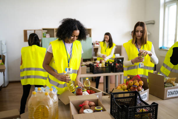 istock Volunteers distributing food contributions into boxes 1485818467