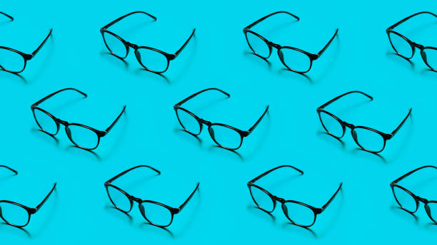 istock Modern black framed reading glasses or spectacles repeated on a bright blue background with minimalist style. 1485818944