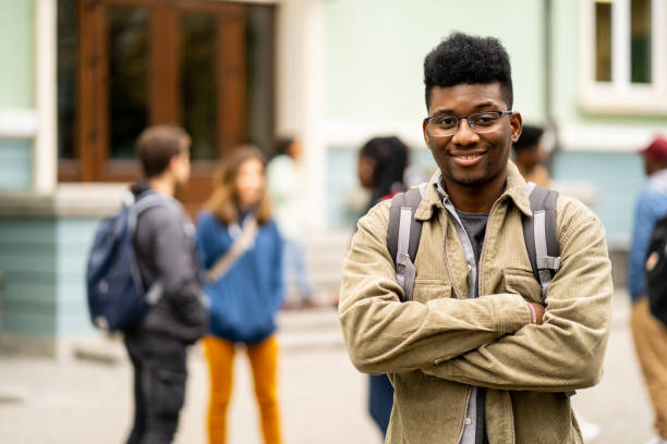 istock Young African-American student standing in front of the University 1485820546