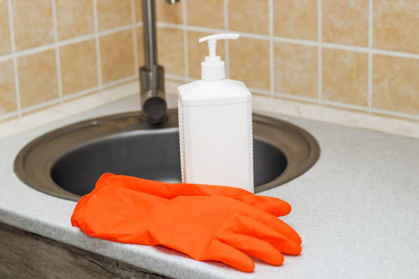 istock Kitchen sink with faucet and gloves for cleaning and detergent 1485821167