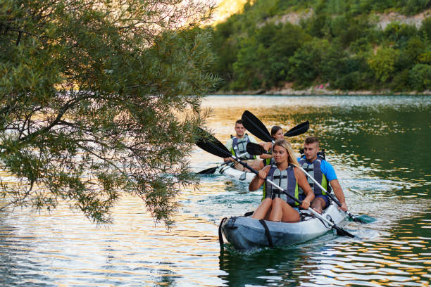 istock A group of friends enjoying having fun and kayaking while exploring the calm river, surrounding forest and large natural river canyons 1485821535