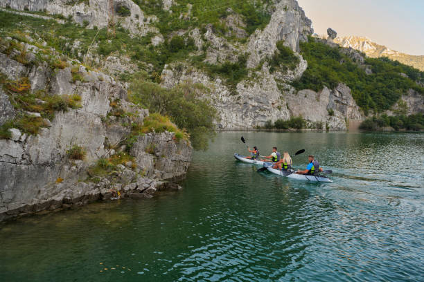 istock A group of friends enjoying having fun and kayaking while exploring the calm river, surrounding forest and large natural river canyons 1485823583